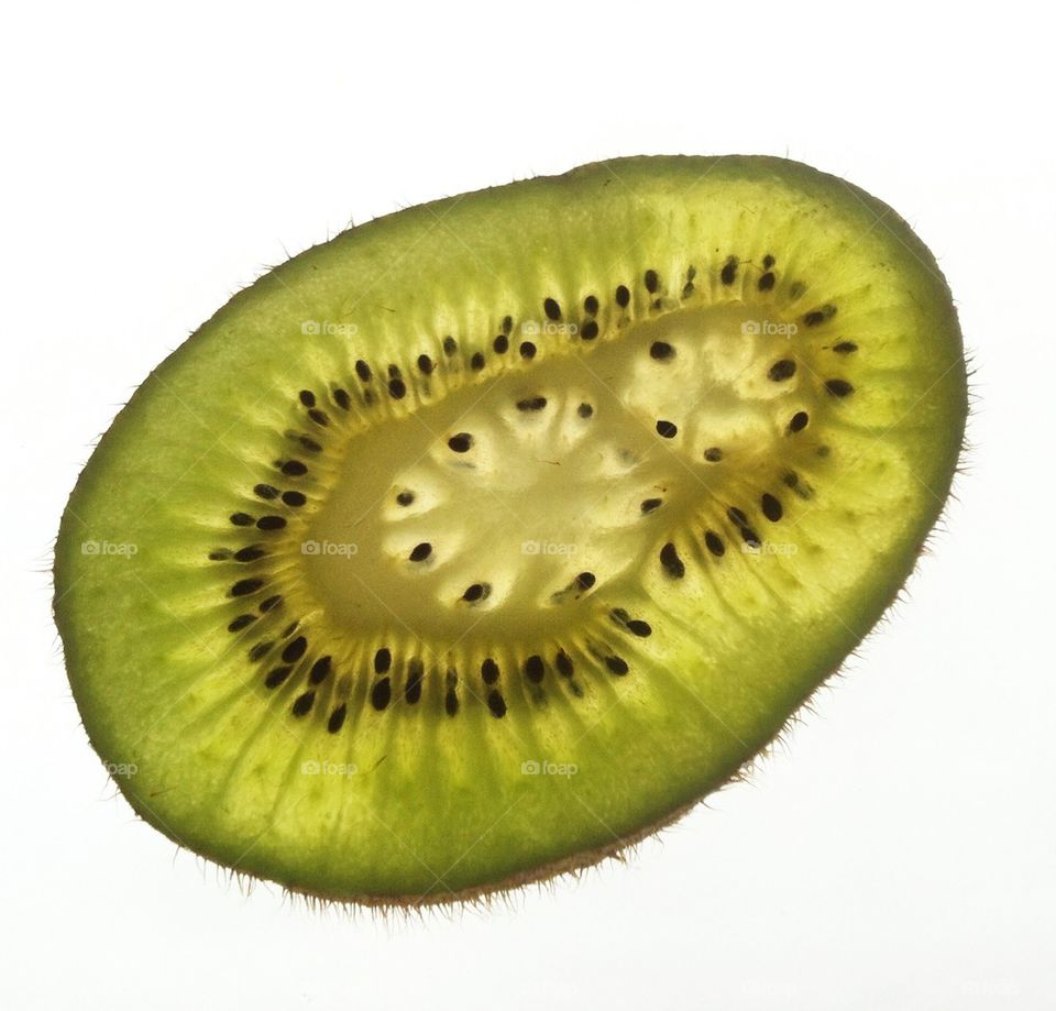 Kiwi gears. Slice of kiwi fruit, isolated 