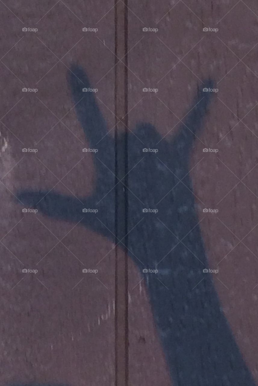 I Love You. Shadow of my hand signing I love you in the last rays of the sun