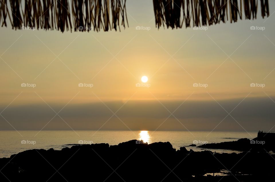 sunset under the umbrella