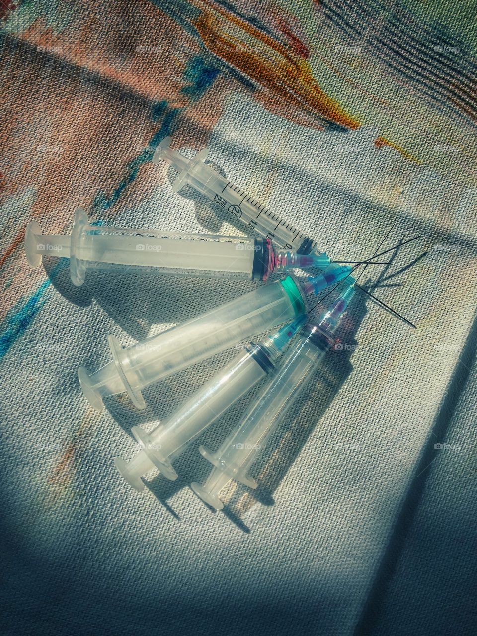 Flat lay of used syringes 