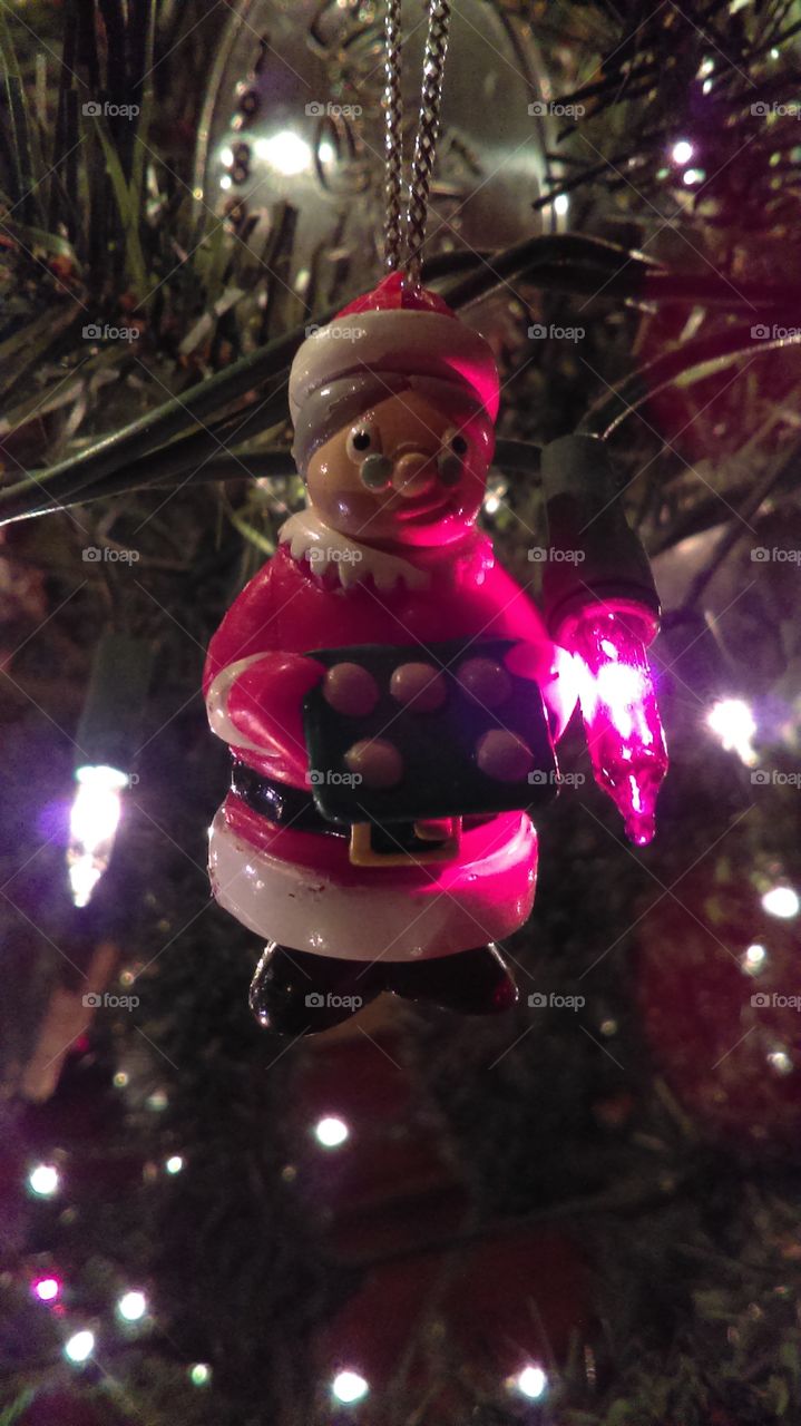 Mrs. Claus Christmas tree ornament and red light