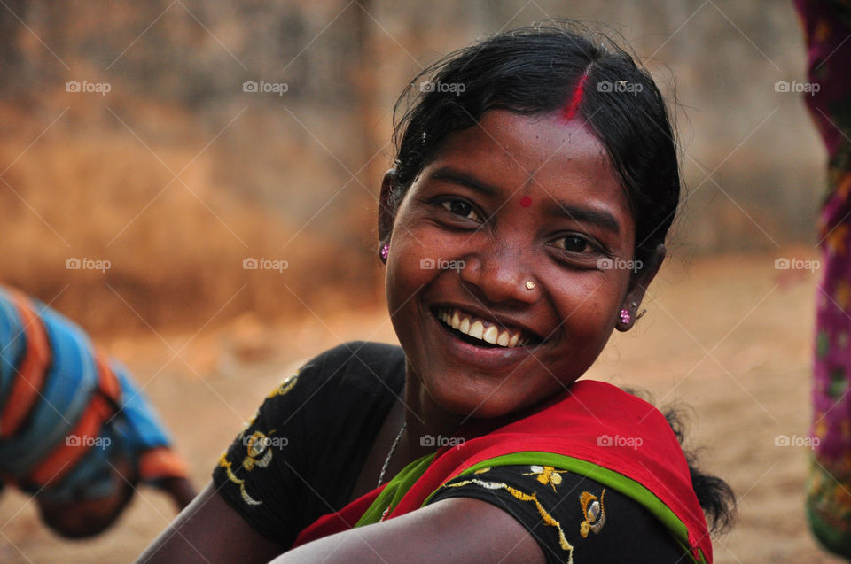 An happy tribal women at a weekly market in Orissa, India.