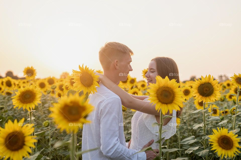 couple in sunflower field