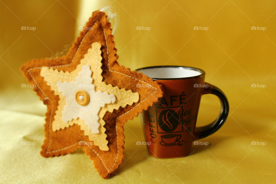 textile star and coffee cup
