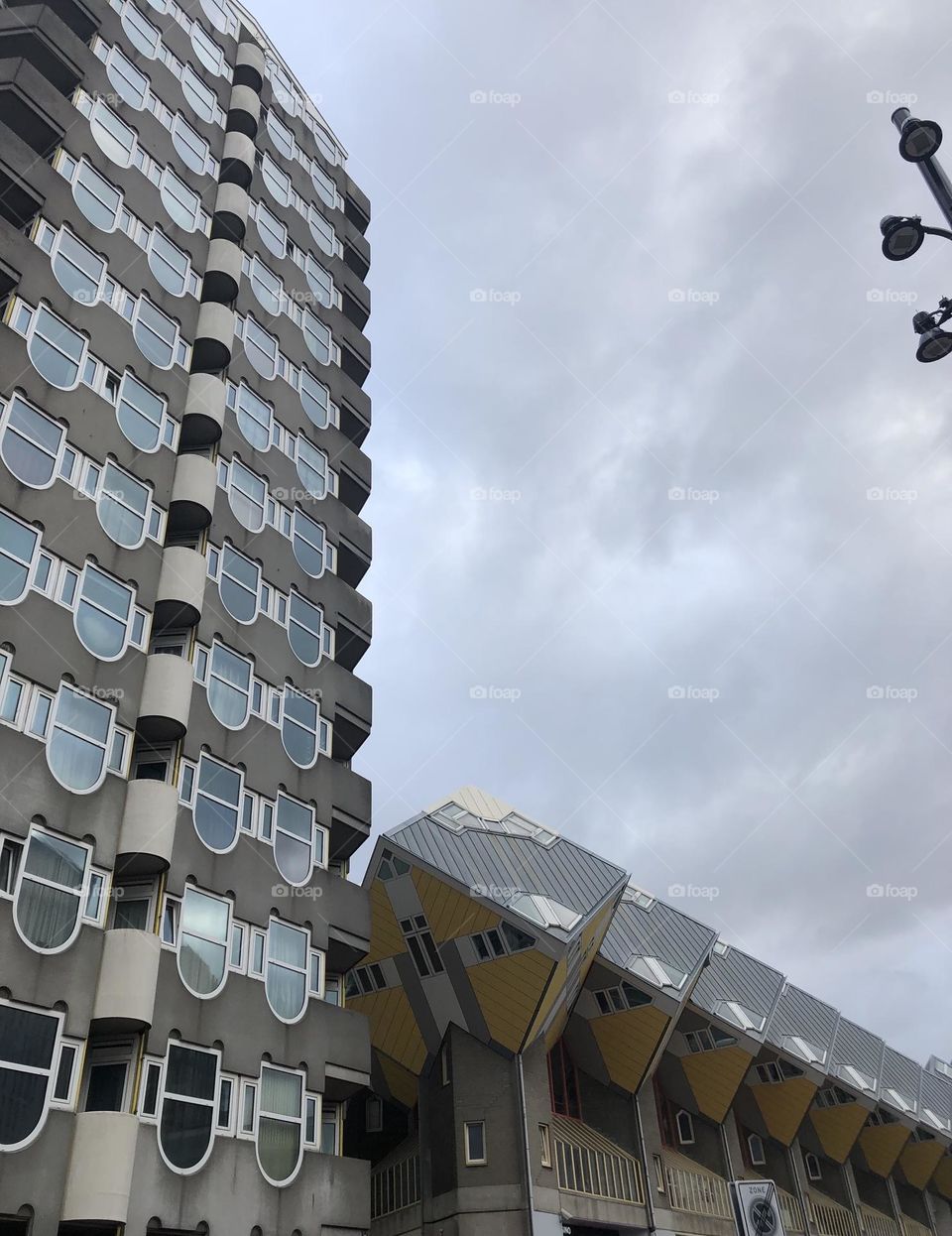 The building and the cube houses side by side