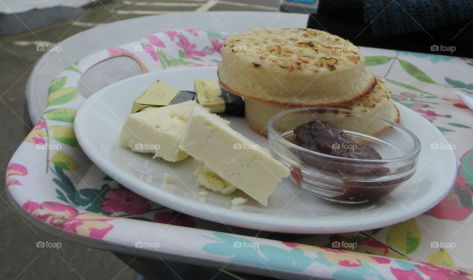 Crumpets with butter cheese and chutney