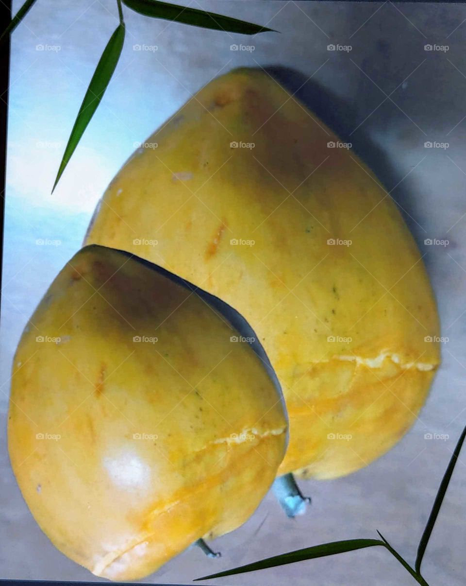 Fruits: Canistel(egg fruit). shape like a big peach, flesh like yellow yolk, soft and sweet. is a famous historical auspicious fruit.