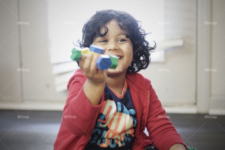 Small child playing with toy