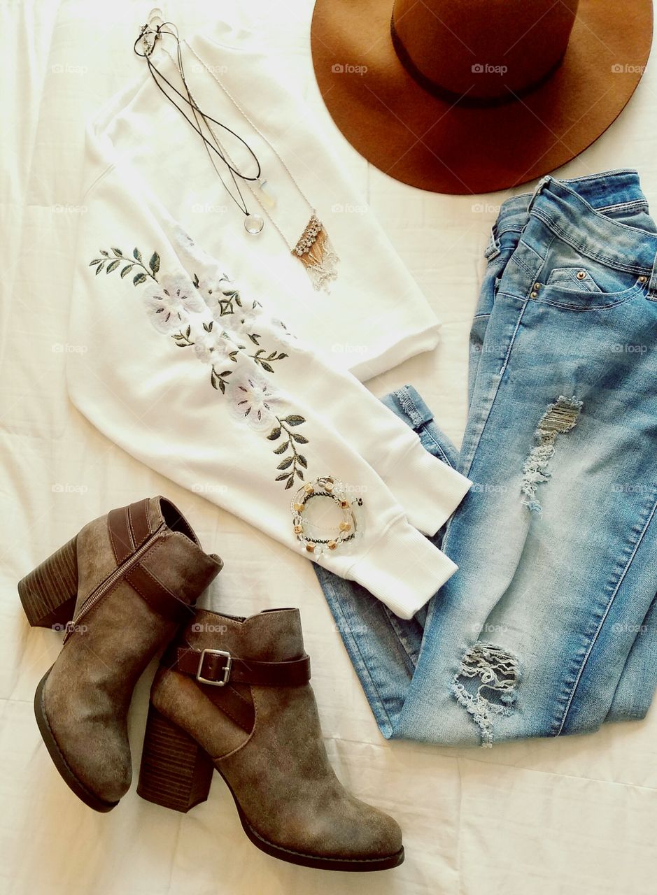 flat lay clothes jeans shirt hat boots