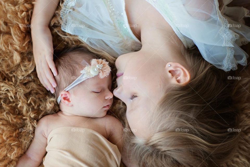 Portrait of baby with sister 