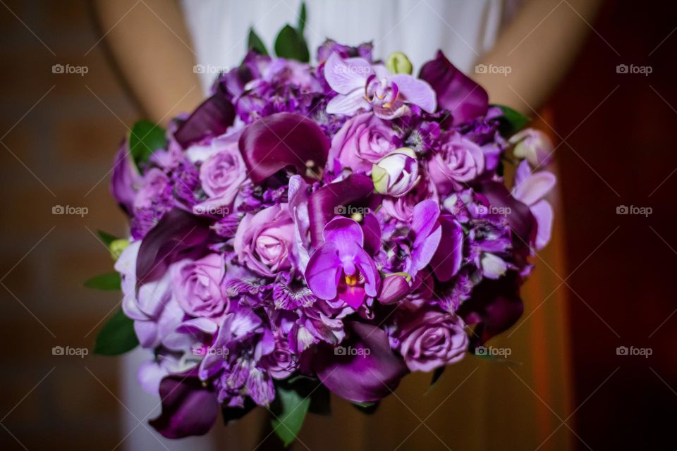 Closeup on a beautiful purple wedding bouquet 