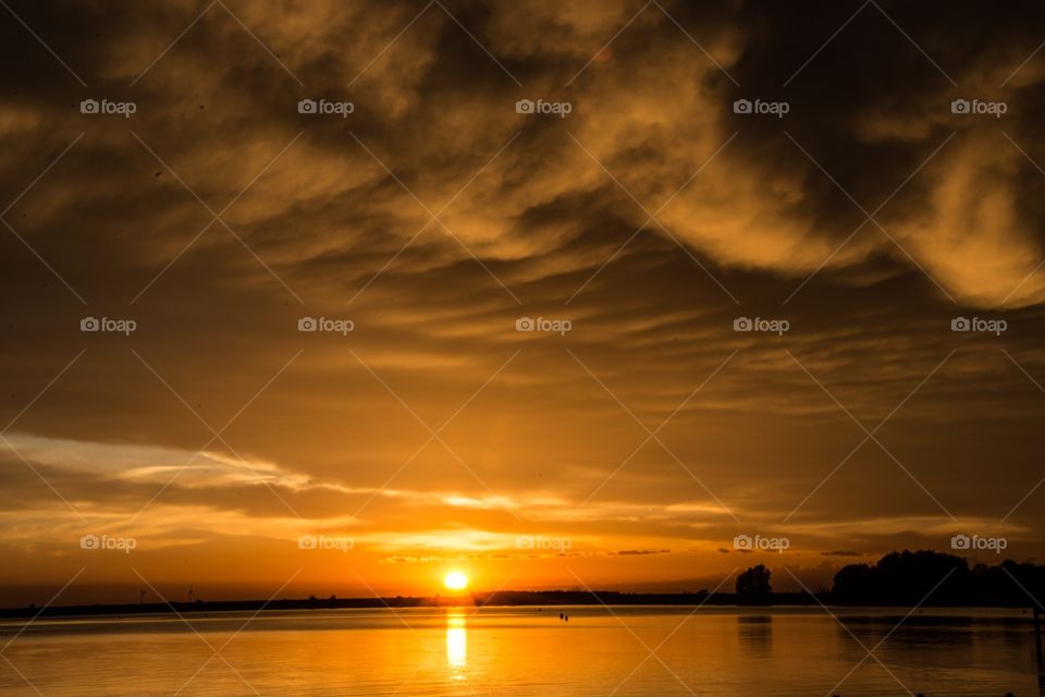 Some dark clouds during a beautiful sunset