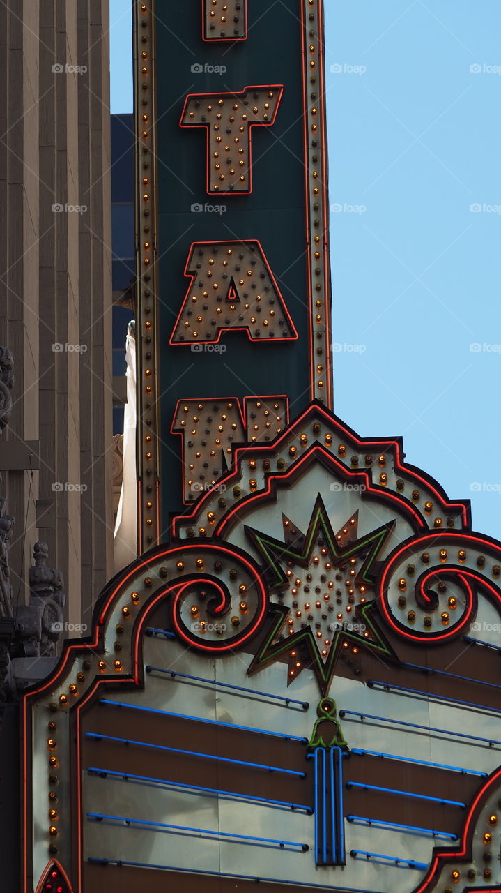 Vintage neon sign theatre . Neon sign theatre facade street city times square