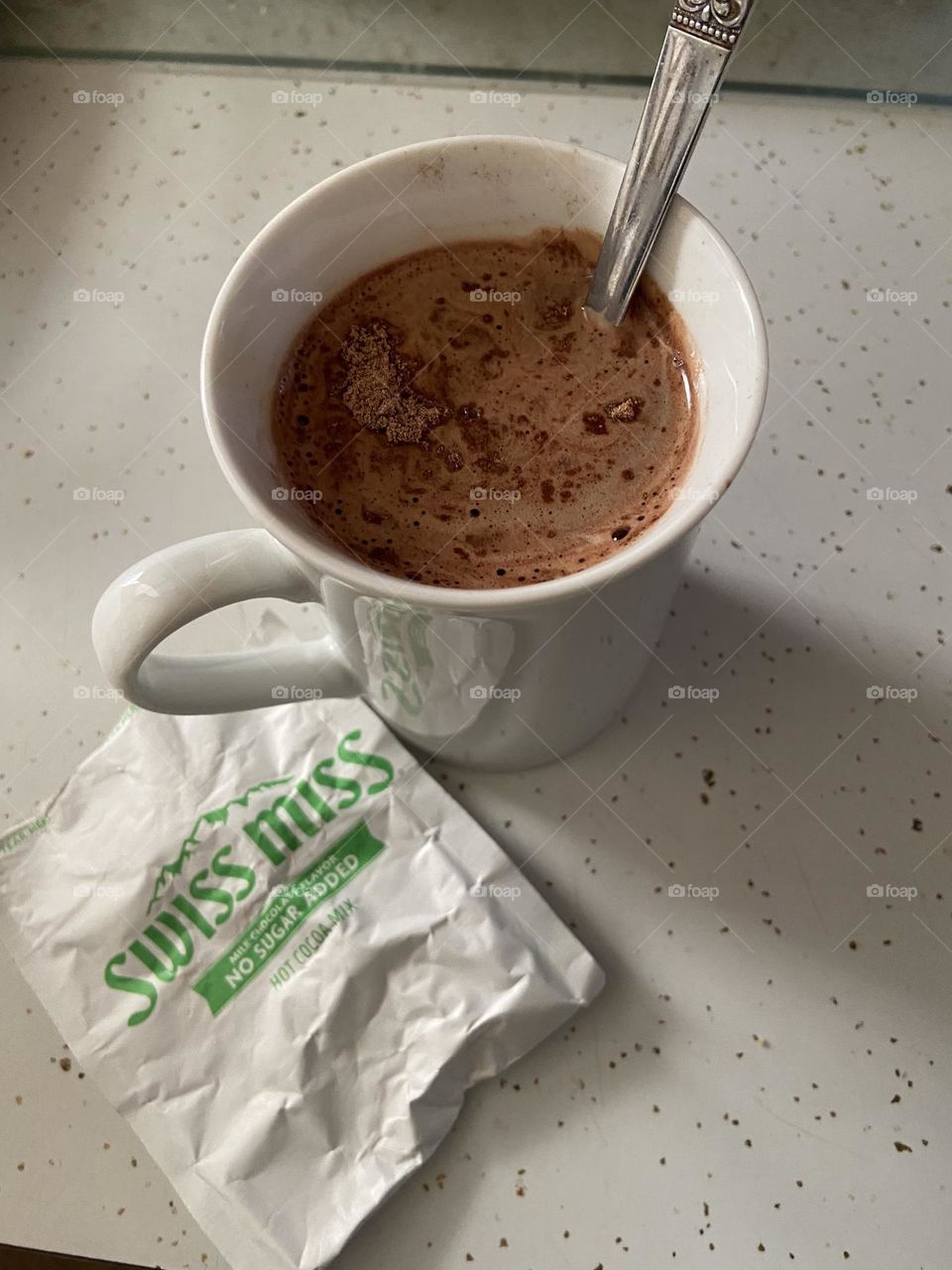 A mug of a hot chocolate mocha, not completely stirred yet. I mixed Swiss Miss sugar free hot cocoa powder with coffee and milk. A delicious pick-me-up. 