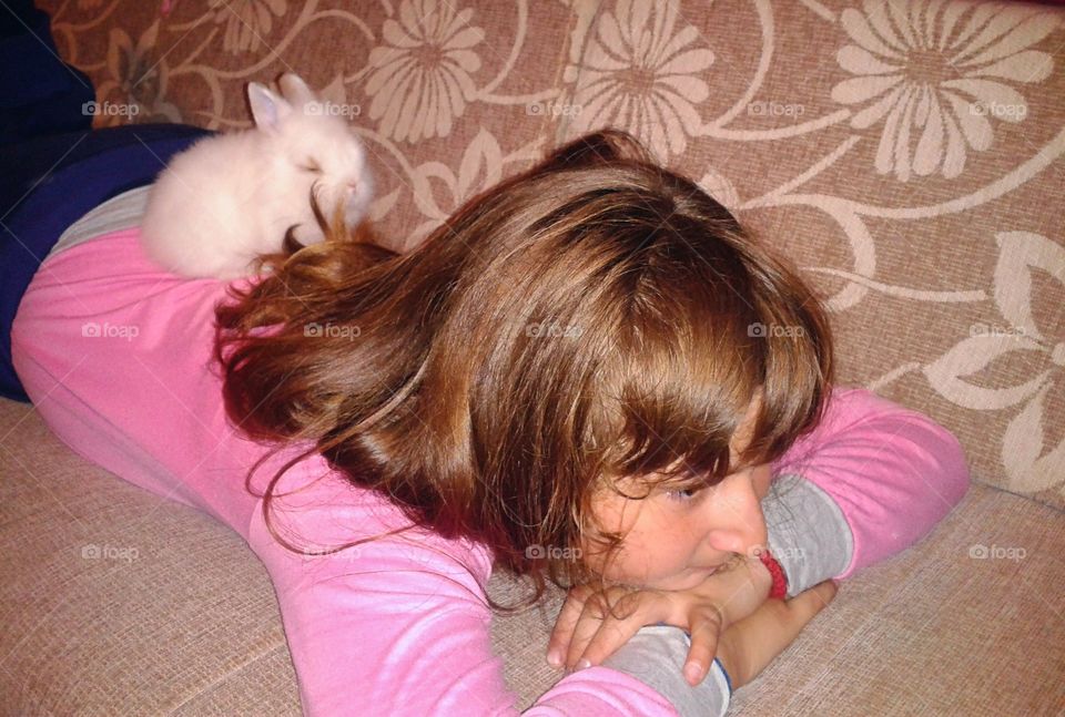 Litlle kid with little rabbit...in they small universe they have lot of thing