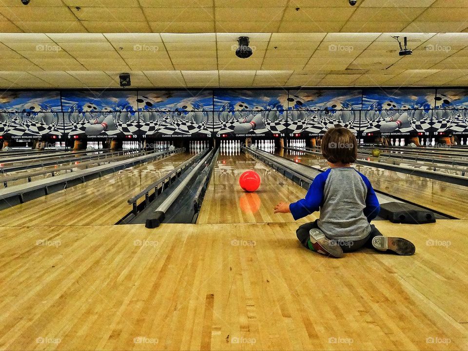 Young boy at bowling alley