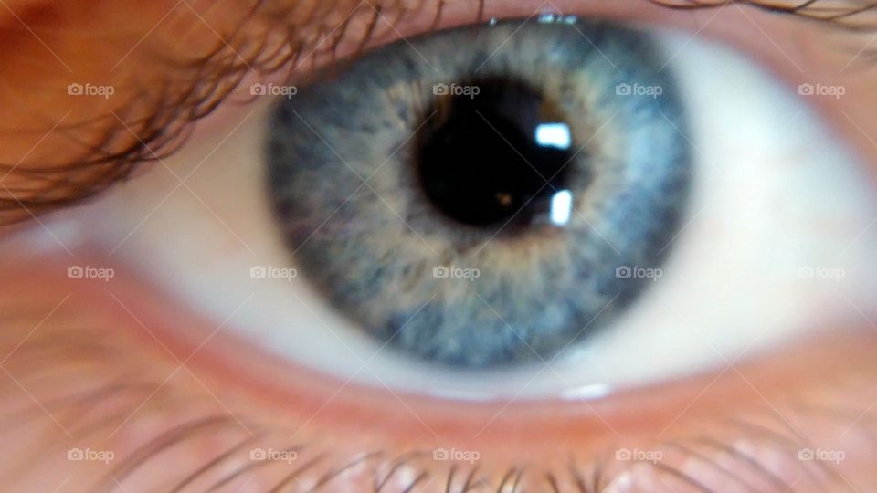 Macro of blue eye with bright lighting