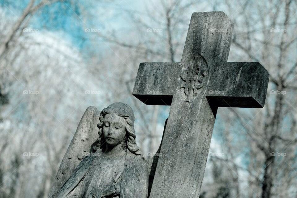 Angel and cross in a Cemetary