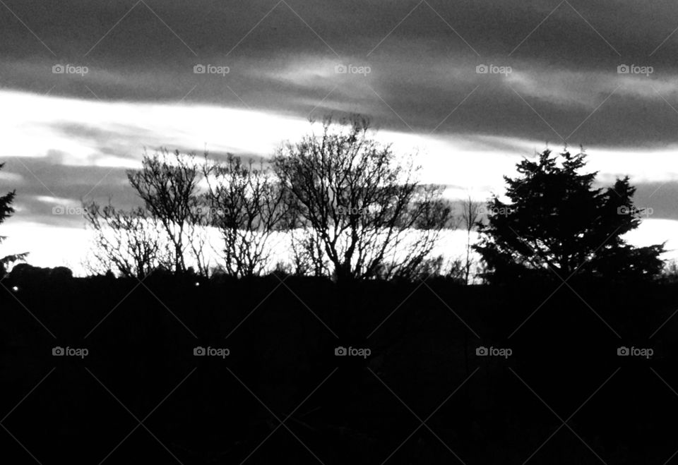 A silhouetted sky in black and white. I like the patterns and different shades of light visible here. A sunset is not only beautiful because of its colours.