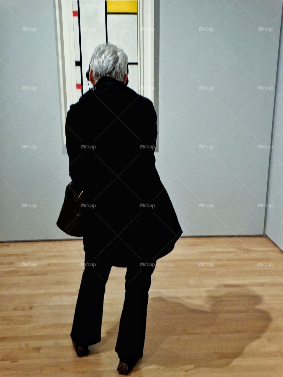 Elderly Woman Looking At A Mondrian Painting In The San Francisco Museum Of Modern Art