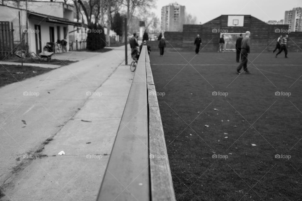 Playing football on the field with artificial grass