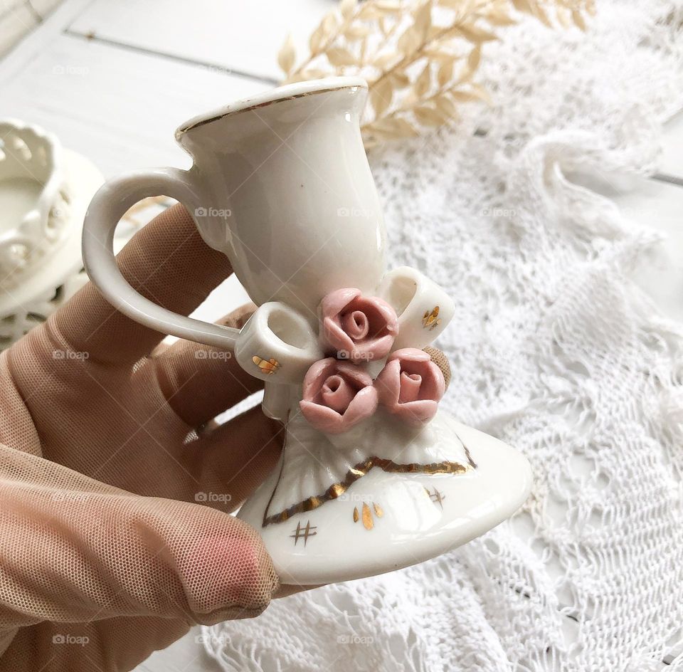 Small vintage candlestick with handle, porcelain flowers and golding 