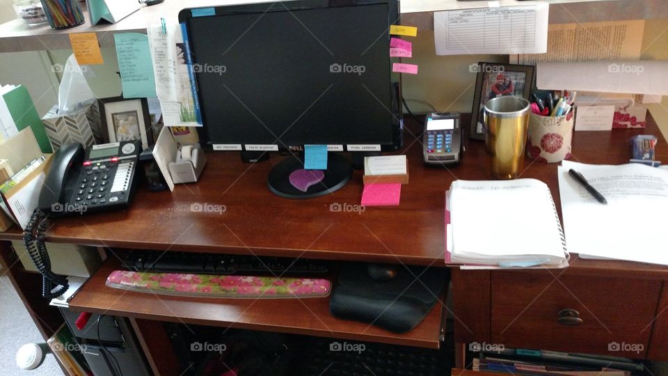 trying to keep her desk organized