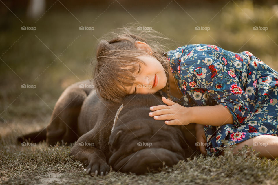 Little girl with sharpie dog