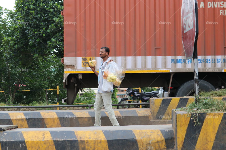 dude selling snacks road side