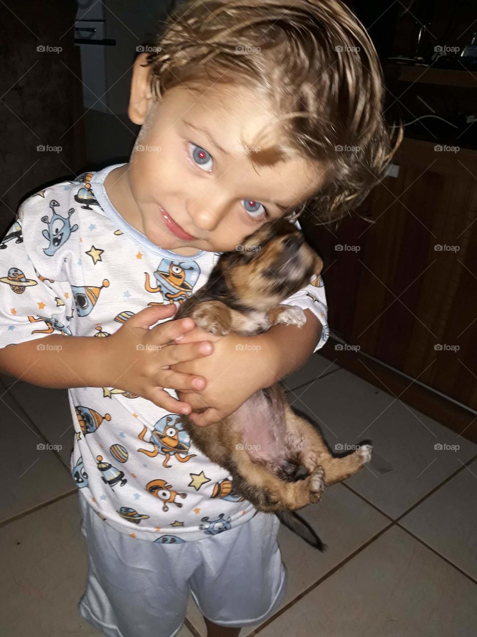 beautiful child playing with the happy dog