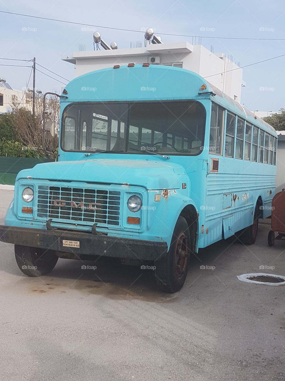 Old aqua school bus in Greece