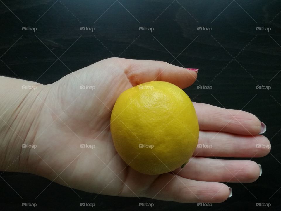 a lemon in hand