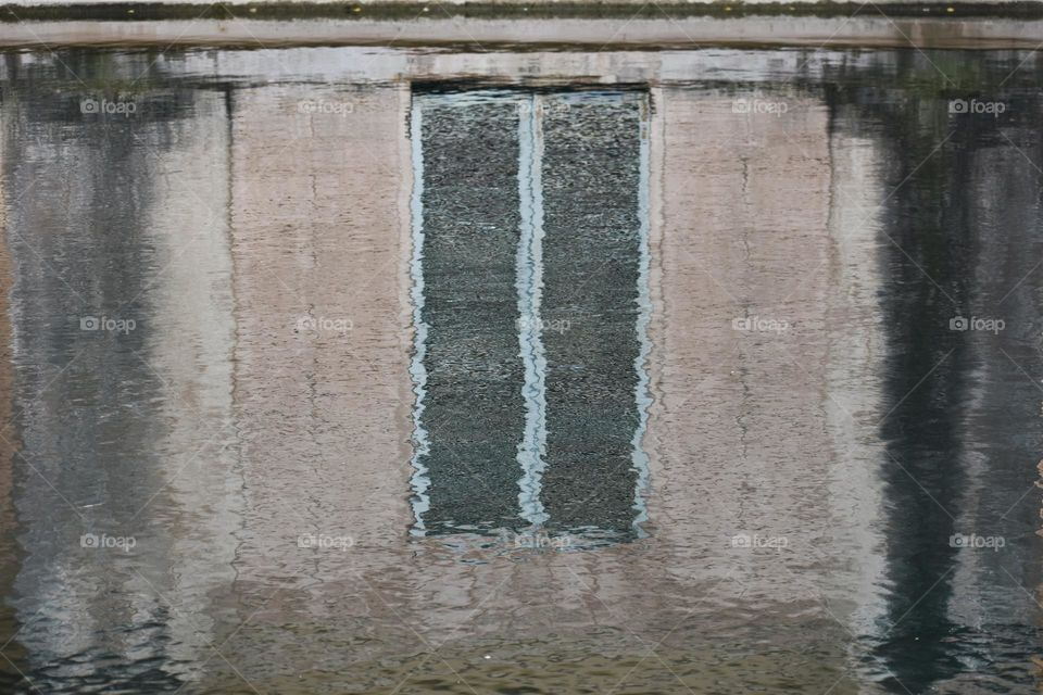 Window view reflected in the water