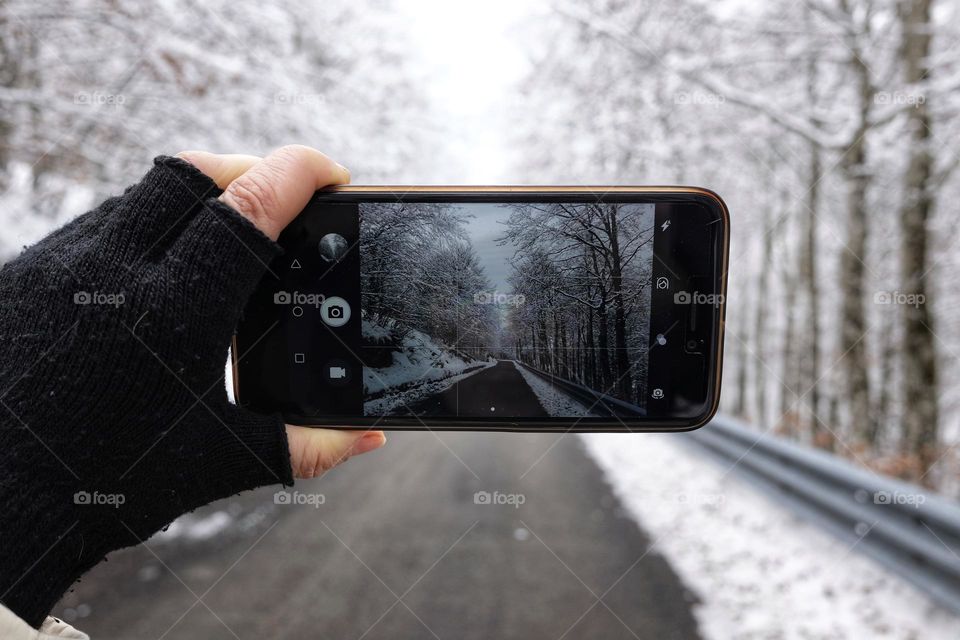 smartphone captures a winter mountain landscape