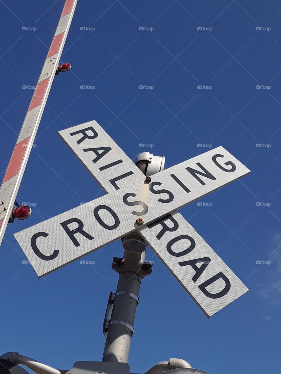 cross the railroad at a safe place.Keep it pushing and going.Railroad is a way of traveling in life.i think it's cool to go by train.Stay safe.Do not cross if this sign is not there.Be wise and good.Follow the rules in life.Watch out for the train