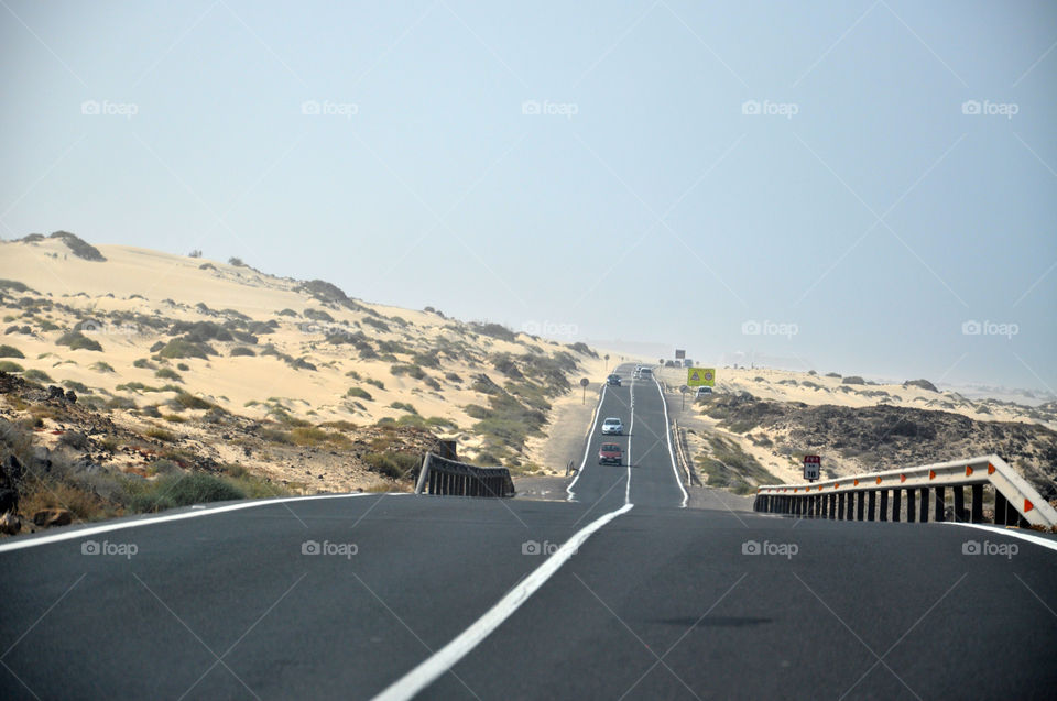 In the dunes . The road 