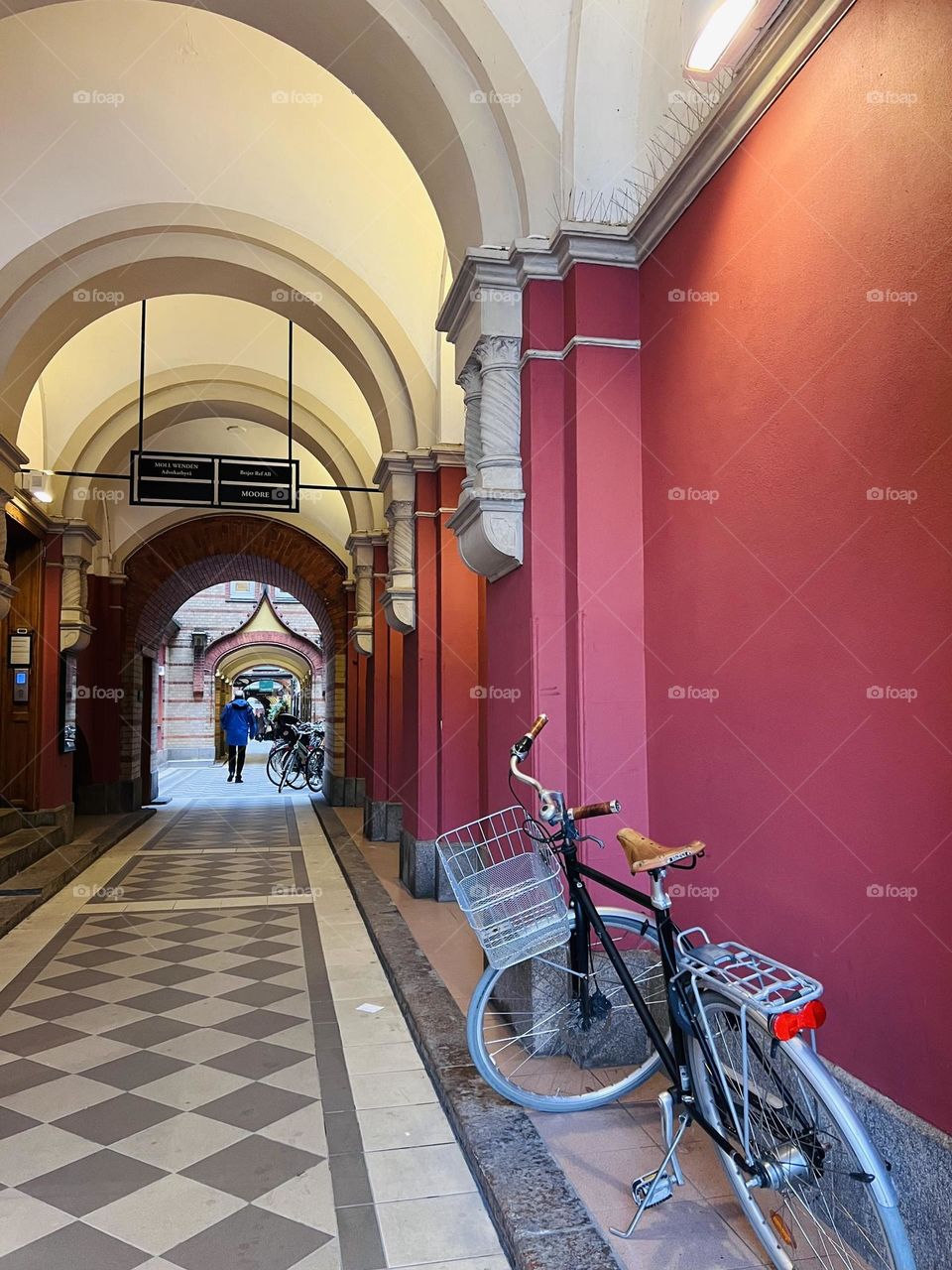 Bicycle parked in an arcade 