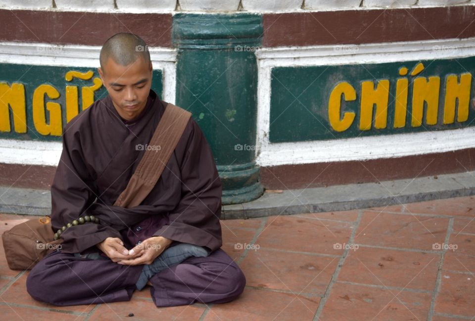 Young Monk. Young monk practicing meditation in the city of Hanoi, Vietnam