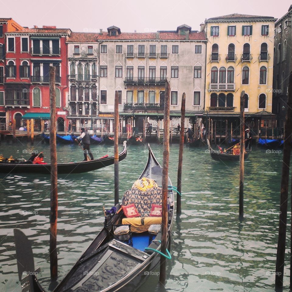 Canals of Venice. Gondoliers dock along the canals of Venice.