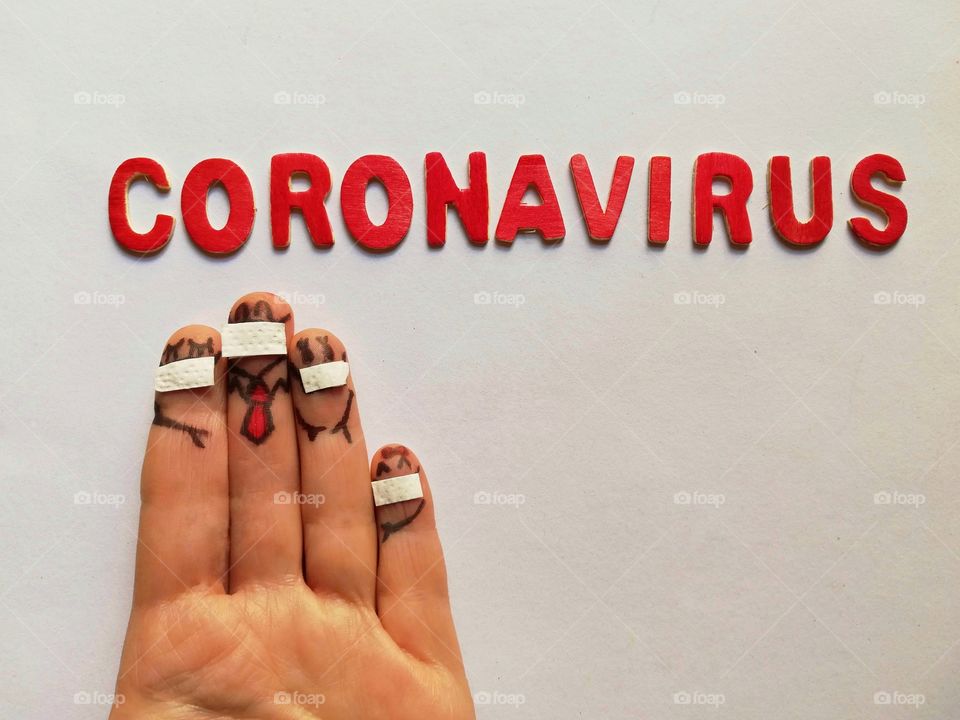 Fingers drawn with masks and written coronavirus