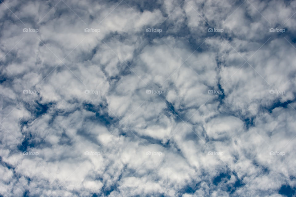 The beauty of the sky with clouds and the sun.