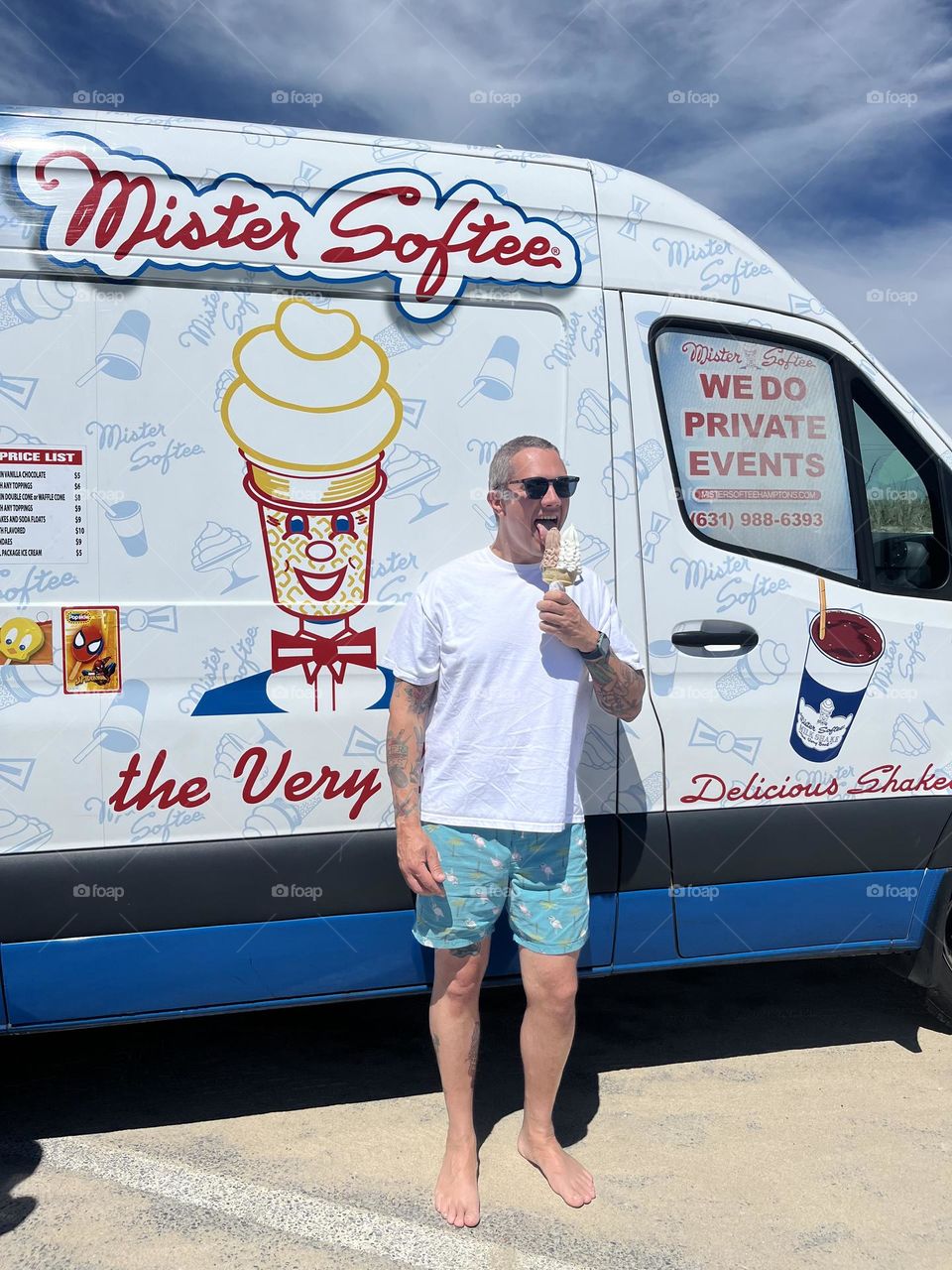 Dad eats ice cream in the summer, Mister Softee ice cream truck, eating ice cream at a beach, father poses with funny truck 