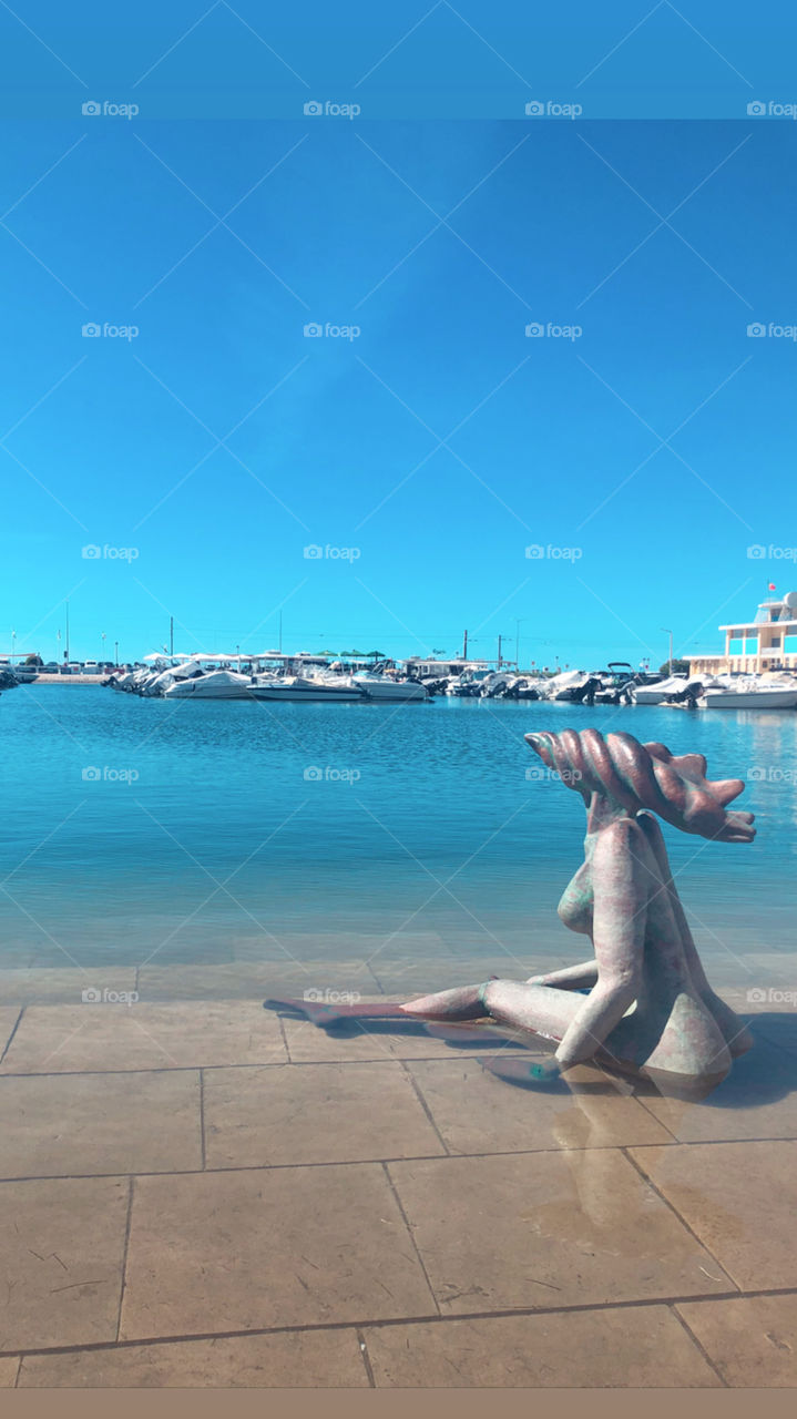 Faro harbor in south of Portugal. This is a beautiful landscape of Algarve with unique ans symbolic statue. This city was so cute!