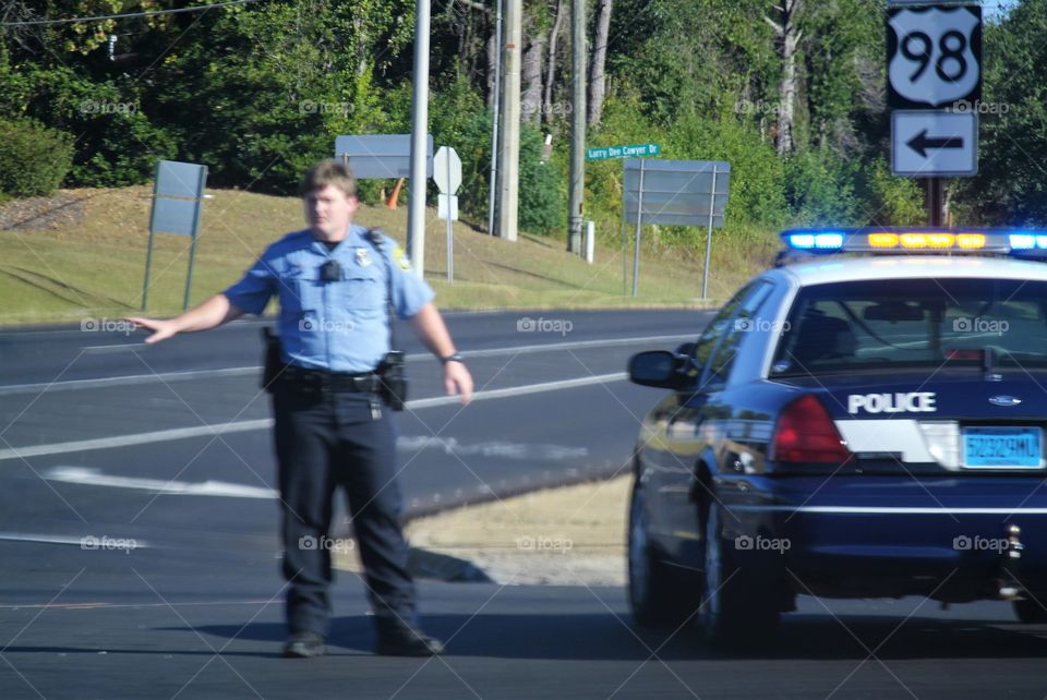 Policeman directing traffic Daphne Alabama 