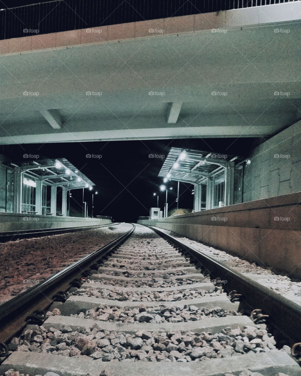 Illuminated railroad station at night