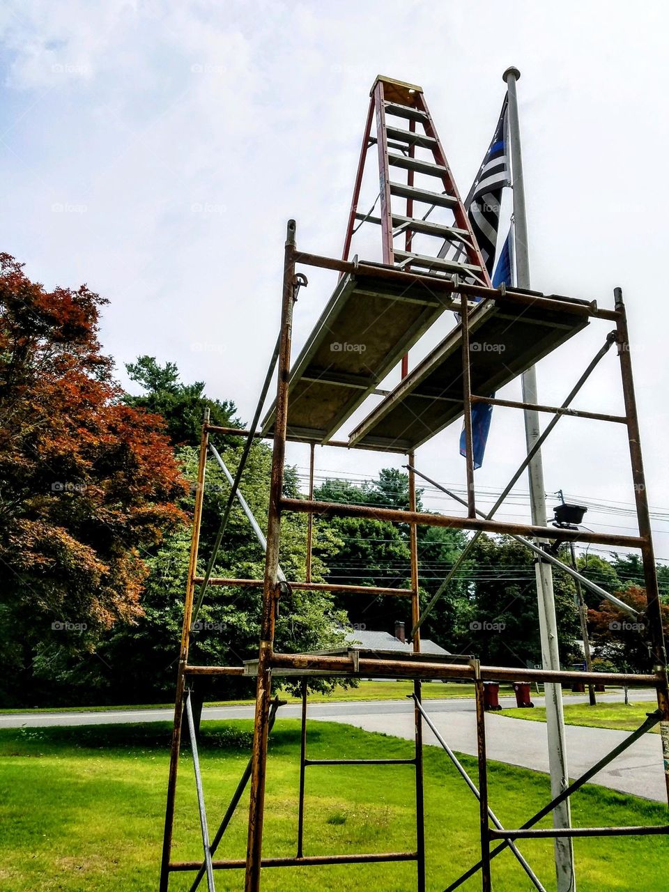 Stupid & dangerous things some people do. This pic involves a ladder and staging to reach the top of a flagpole!😁