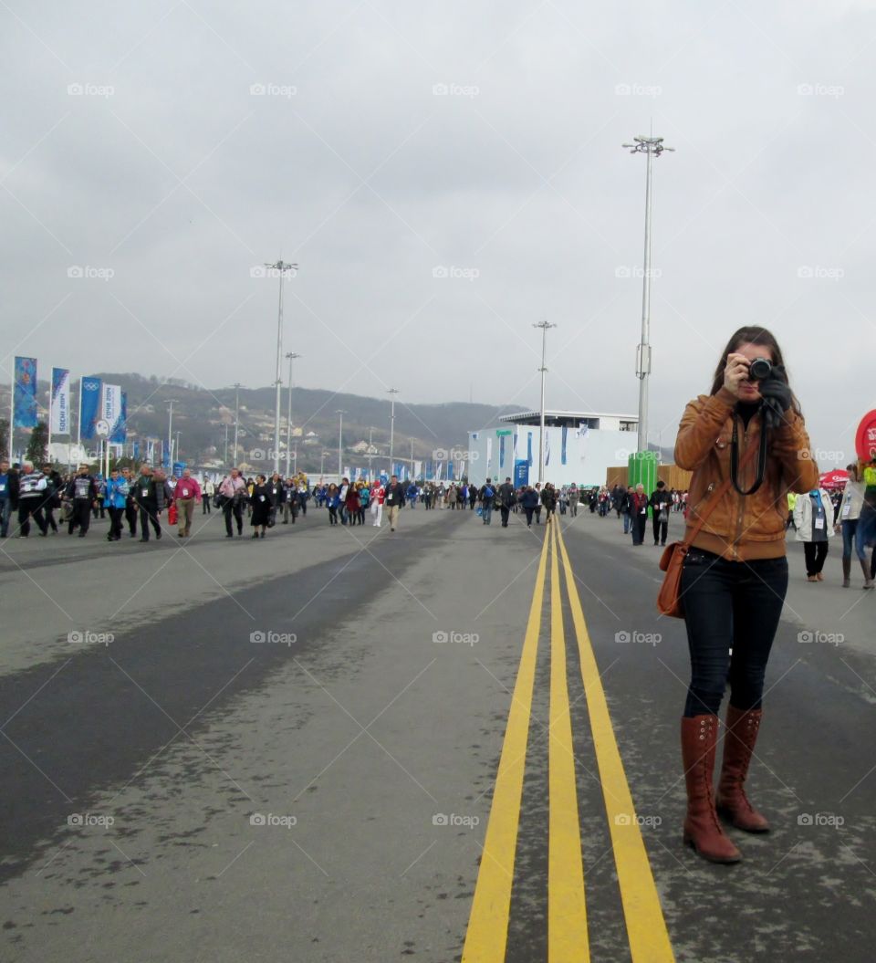 The girl is holding a camera