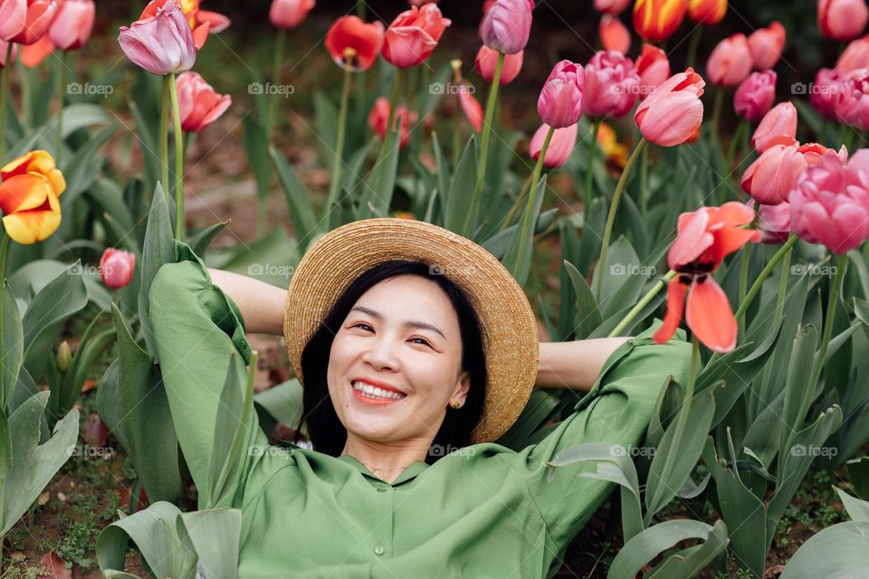 Beautiful Asian woman and tulips 