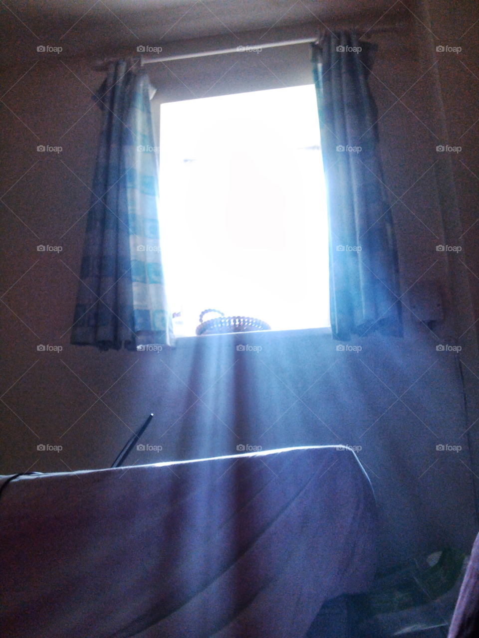 Sunbeams through a basement window