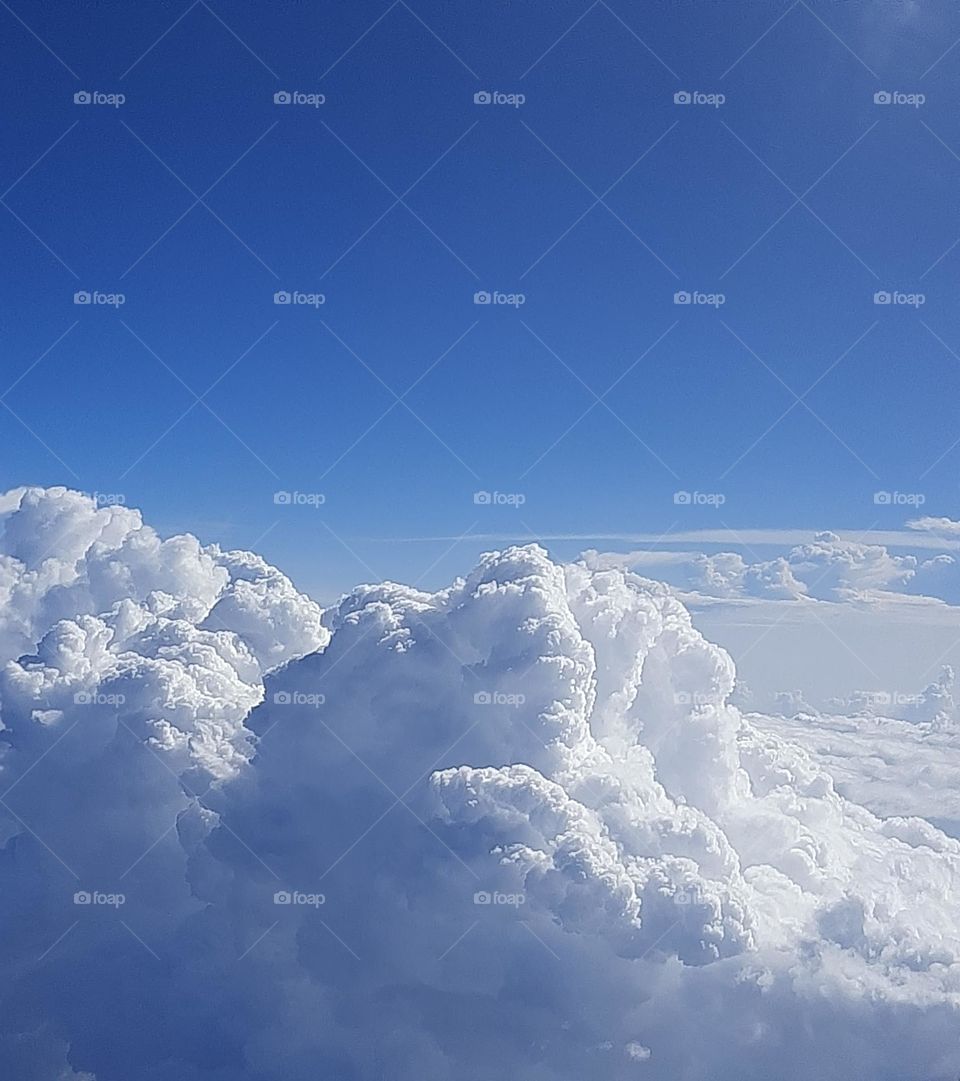 White clouds and blue sky at high altitude